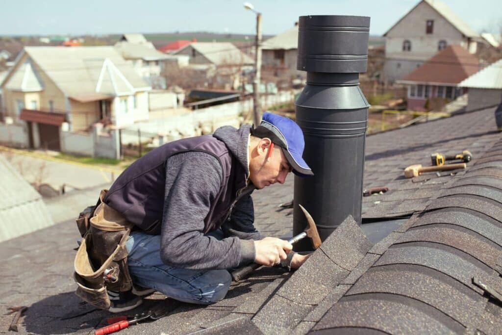 A professional roof installer doing his job